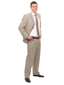 Full Body portrait of a young smiling business man with hands on side.
